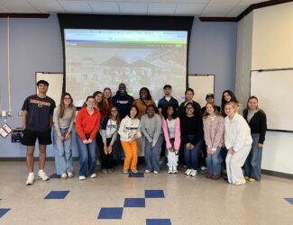 Advertising students pictured with their client, H3.